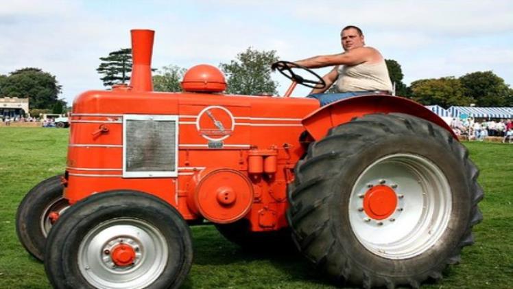 man riding electric tractor